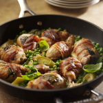 Bacon-wrapped chicken with leeks, peas & basil